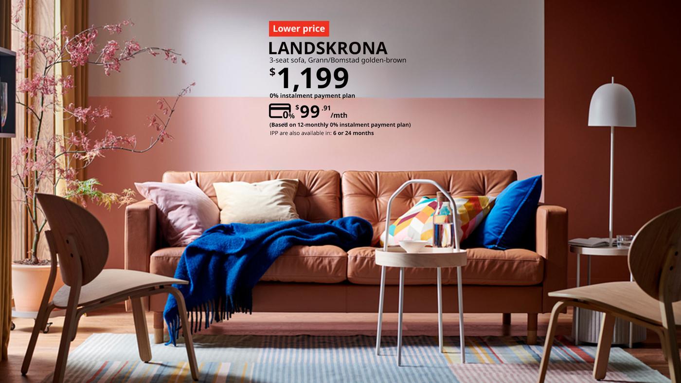 A golden-brown leather LANDSKRONA 3-seat sofa in a living room setting, priced at $1,199 but now can be paid for $99.91 per month for 12 months