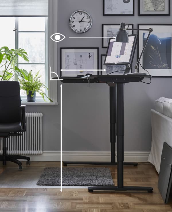 A graphic showing the right desk height and body position for working while standing at a desk.