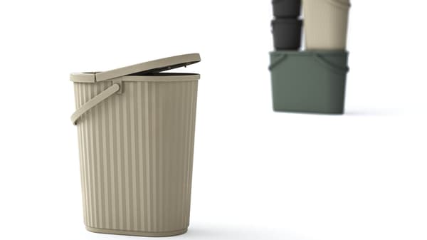 A gray-beige bin with a lid at the front and other colored bins in the background.