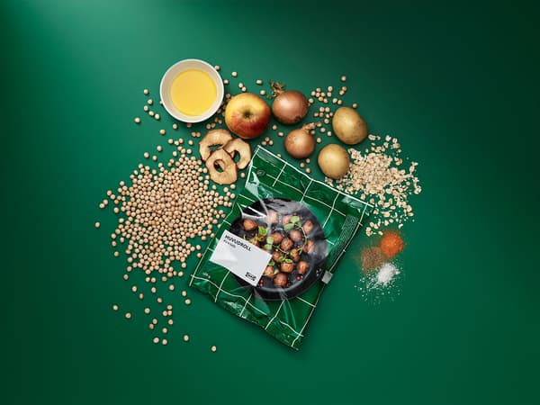 A green bag of IKEA plantballs with an assortment of the products ingredients.