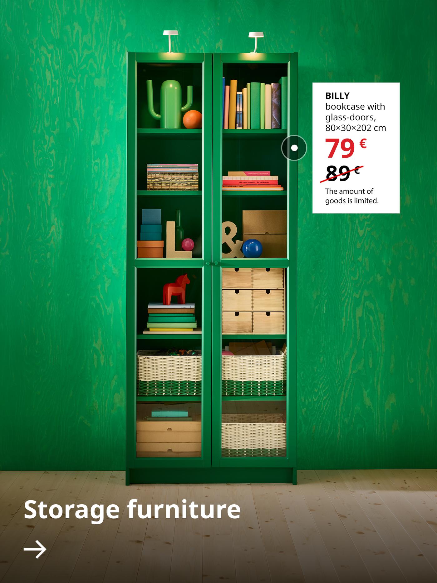 A green BILLY bookcase with glass doors stands by the green wall. Next to it, on a white background, its sale price is shown — 79 € (regular price 89 €). Below, there is an arrow with the text “Storage furniture”.