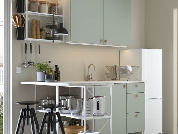 A green ENHET kitchen