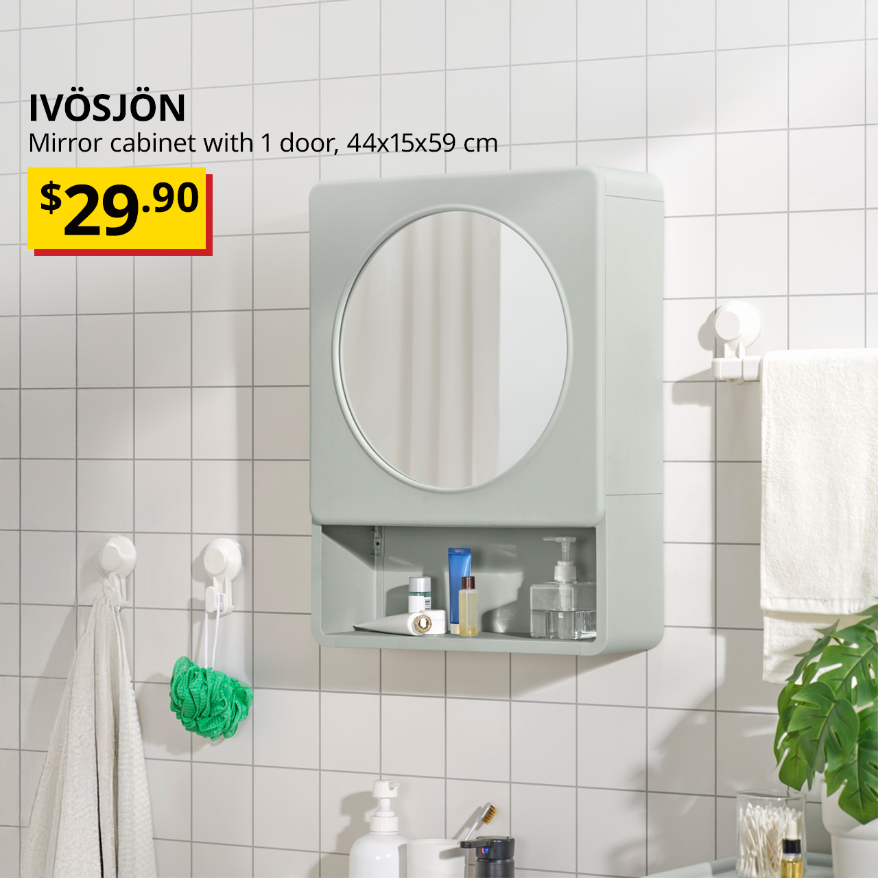 A green IVÖSJÖN mirror cabinet with 1 door in a bathroom setting. Black text on image reads "IVÖSJÖN, Mirror cabinet with 1 door, 44x15x59 cm. Price: $29"