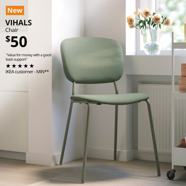 A green VIHALS chair is placed in the corner of a room. A orange with white 'New' tag on the top left corner of the image. Followed by black text over image that reads "VIHALS, Chair, Price at $50. "Value for money with a good back support" - reviewed by IKEA Customer MIN**"