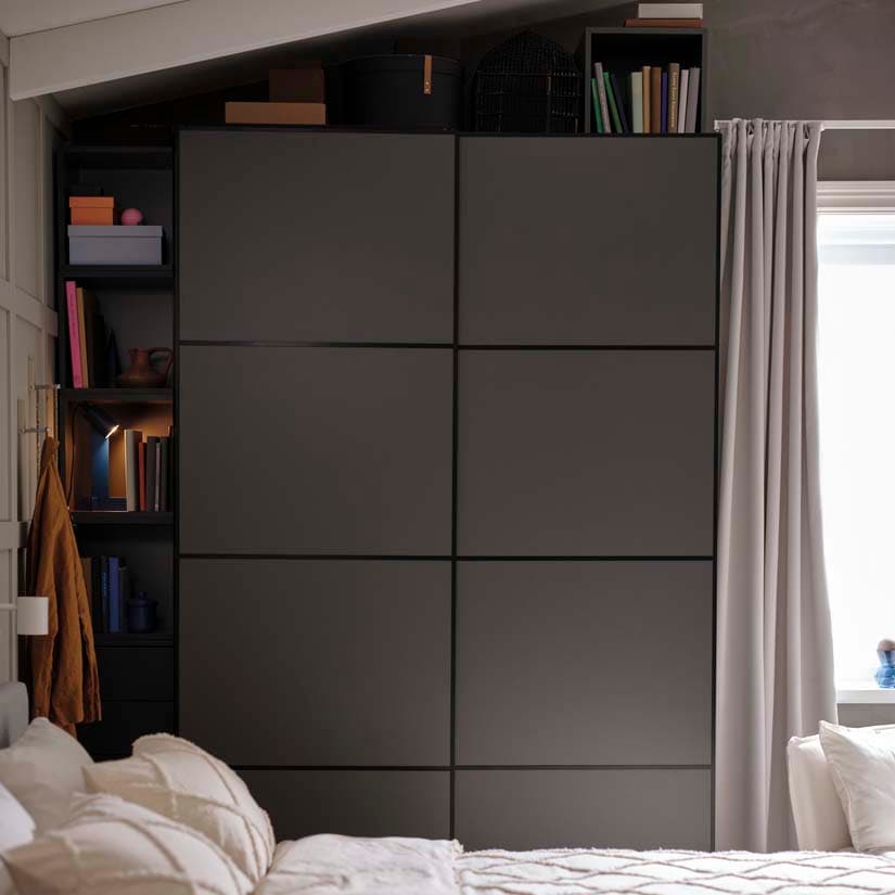 A grey PAX wardrobe with sliding doors