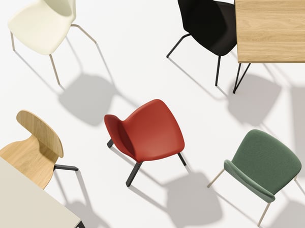 A grey plain chair in a modern room.