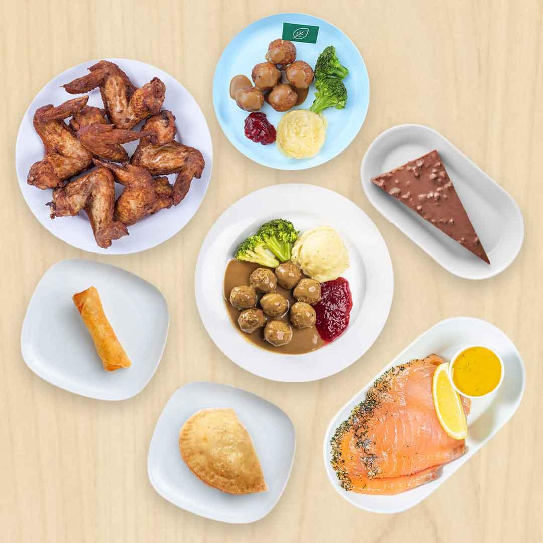 A group image of Swedish meatballs, chicken wings, kids meat balls, marinated salmon, chocolate almond cake, spring rolls and currypuf