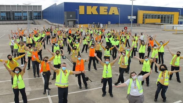 A group of IKEA co-workers standing outside the IKEA store.