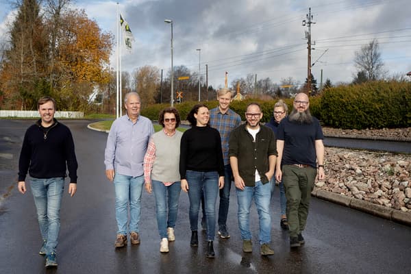A group of people are walking on a road.