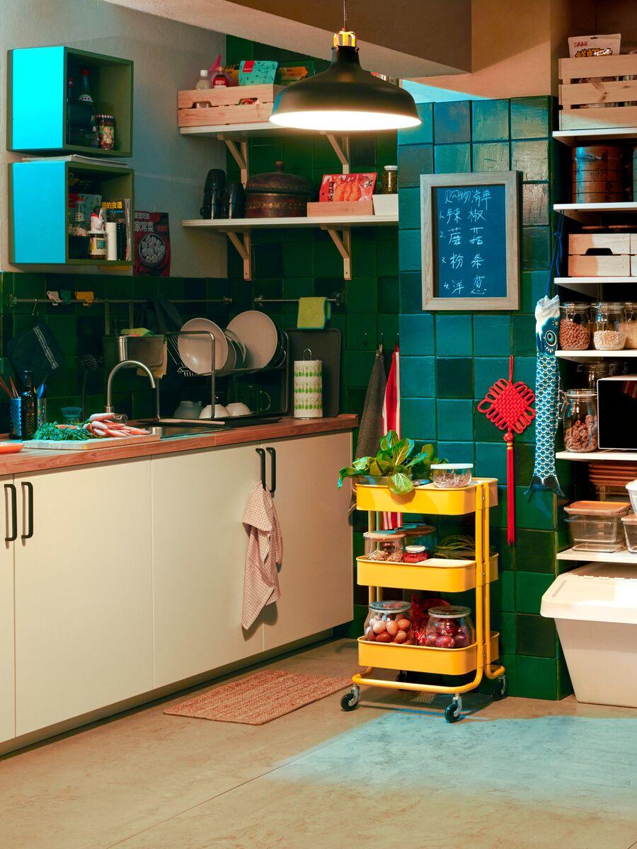 A group of people cooking at their kitchen.