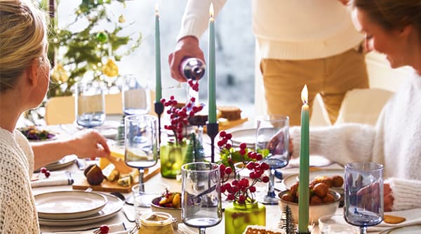 A group of people enjoying some IKEA food at a dinner party.