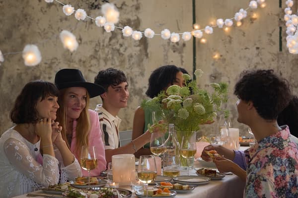 A group of people is sitting at the festive table