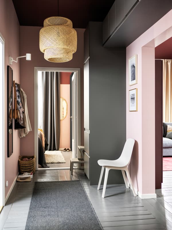 A hallway with a storage combination made from gray METOD cabinets with shelves and four drawers plus wall mounted cabinets.
