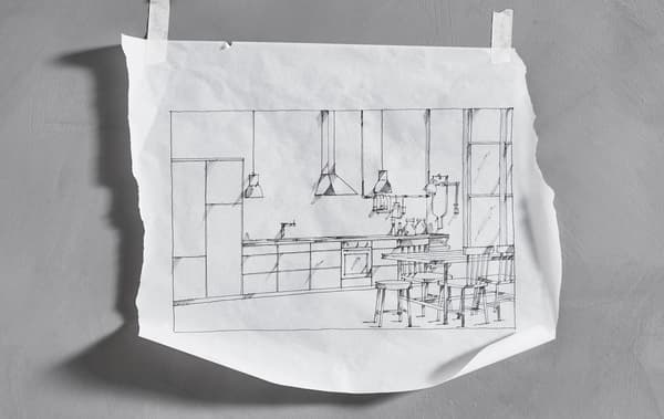 A hand-drawn sketch of a straight-line IKEA kitchen that’s taped to a wall 