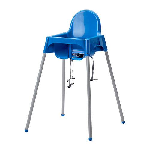 A high chairs with a blue seat against a white background.