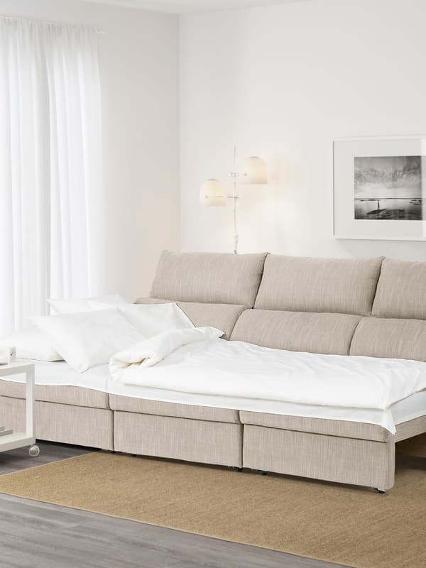 A Hillared beige ESKILSTUNA three-seat sofa with chaise longue