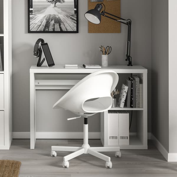 A home office with grey walls showing IKEA KALLAX and LOBERGET desk and chair in white. 