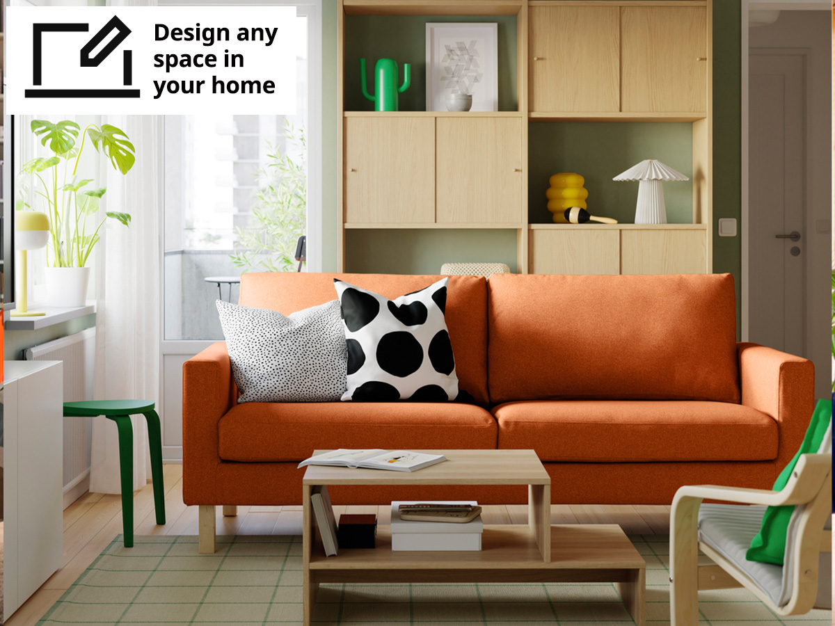 A image of a living room setting with a tonerud red-brown SALTSJÖBADEN 3-seat sofa placed infront of a oak effect LÅDMAKARE storage combination shelving unit with sliding door.