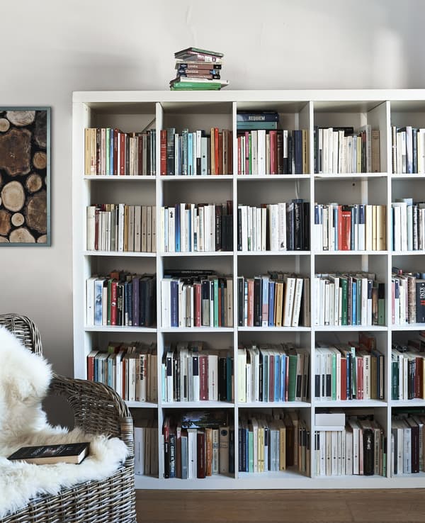 A KALLAX unit full of books.