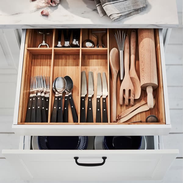 A kitchen drawer is open, and inside is a VARIERA cutlery tray in bamboo that helps organise cutlery and kitchen utensils.
