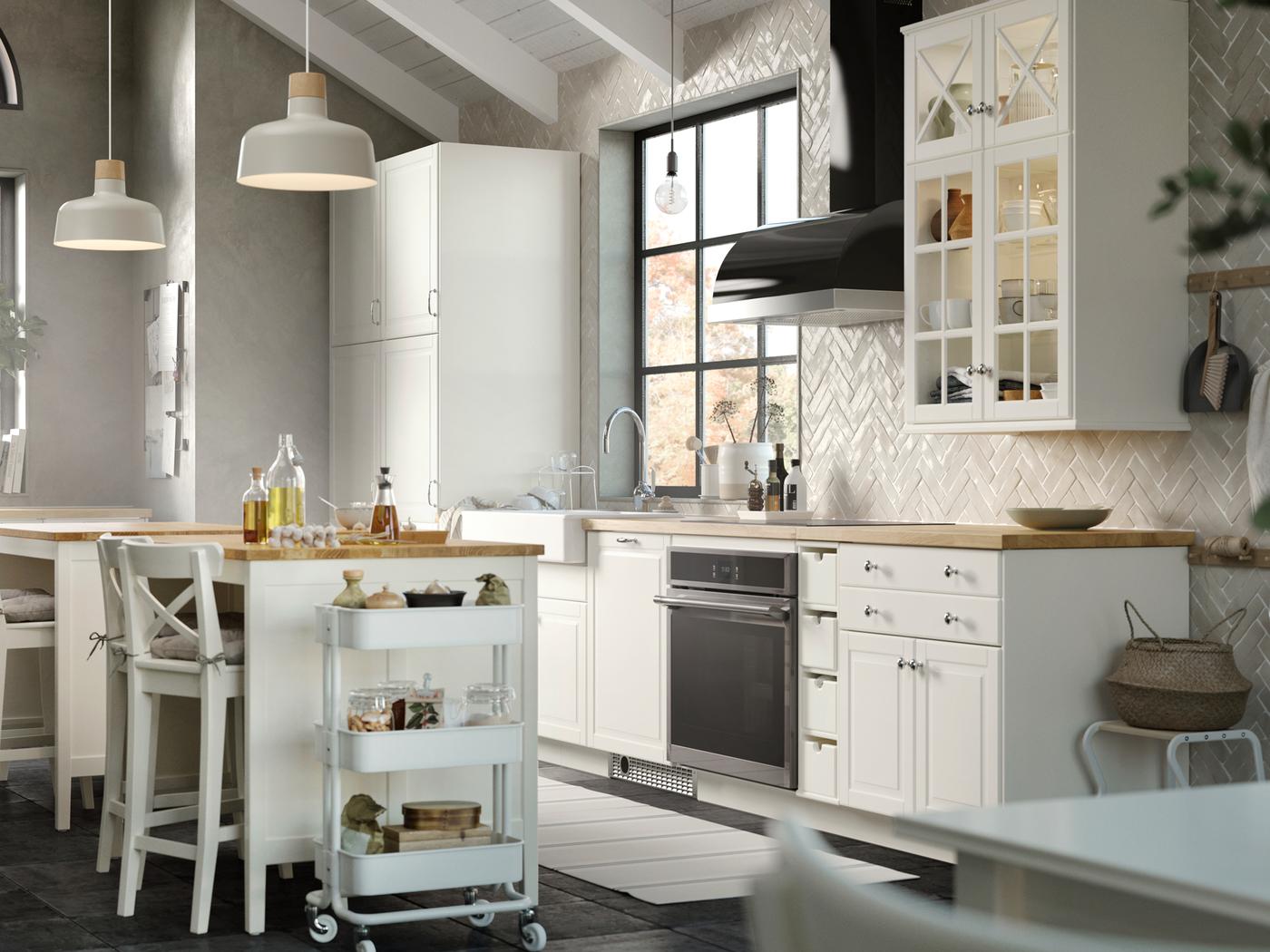 A dark, modern U-shaped kitchen - IKEA CA
