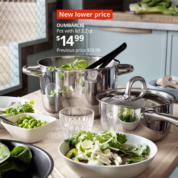 A kitchen table with pots and bowls with food, New lower price OUMBÄRLIG Pot with lid 3.2 qt $14.99, Previous price $19.99. 