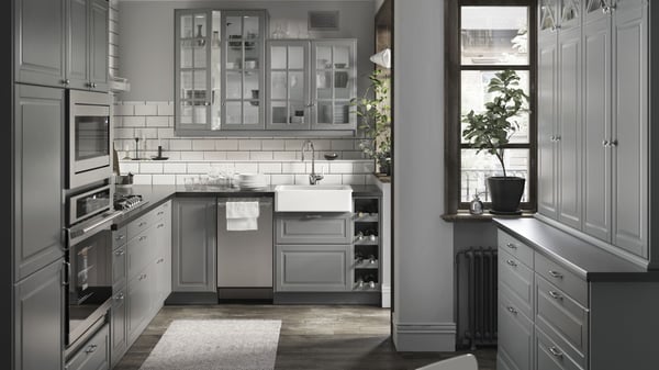 A kitchen with IKEA cabinets and accessories featuring the BODYN collection.