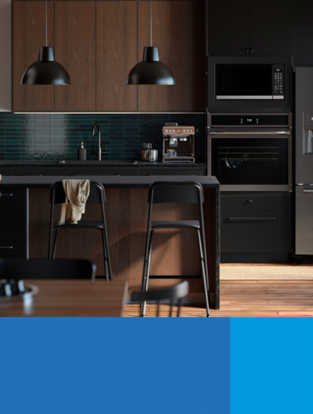 A kitchen with lighting and bar stools