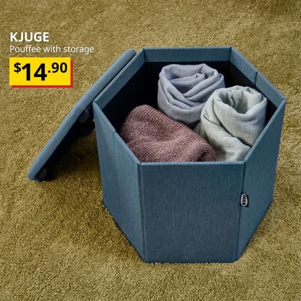A knisa medium blue KJUGE pouffee with storage opened to show the storage space. On the top left of the image with white text over image that reads "KJUGE, Pouffee with storage" BTI Price: $14.90.