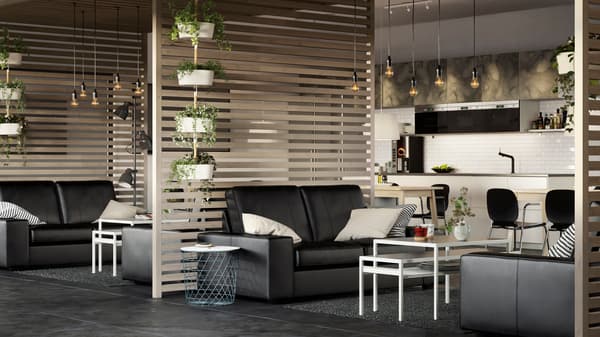 A large airy business office space with KIVIK black leather sofas and slatted wood room dividers.