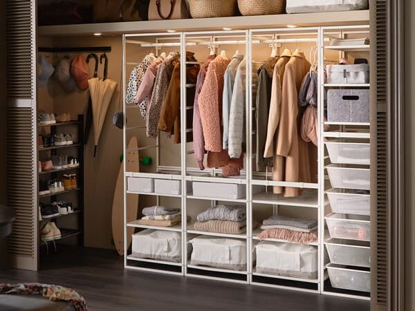 A large open JONAXEL wardrobe in white.