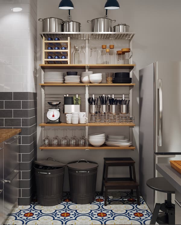 A large wall-mounted storage solution with wooden shelves, containers, rails grids and more and it holds many kitchen items.