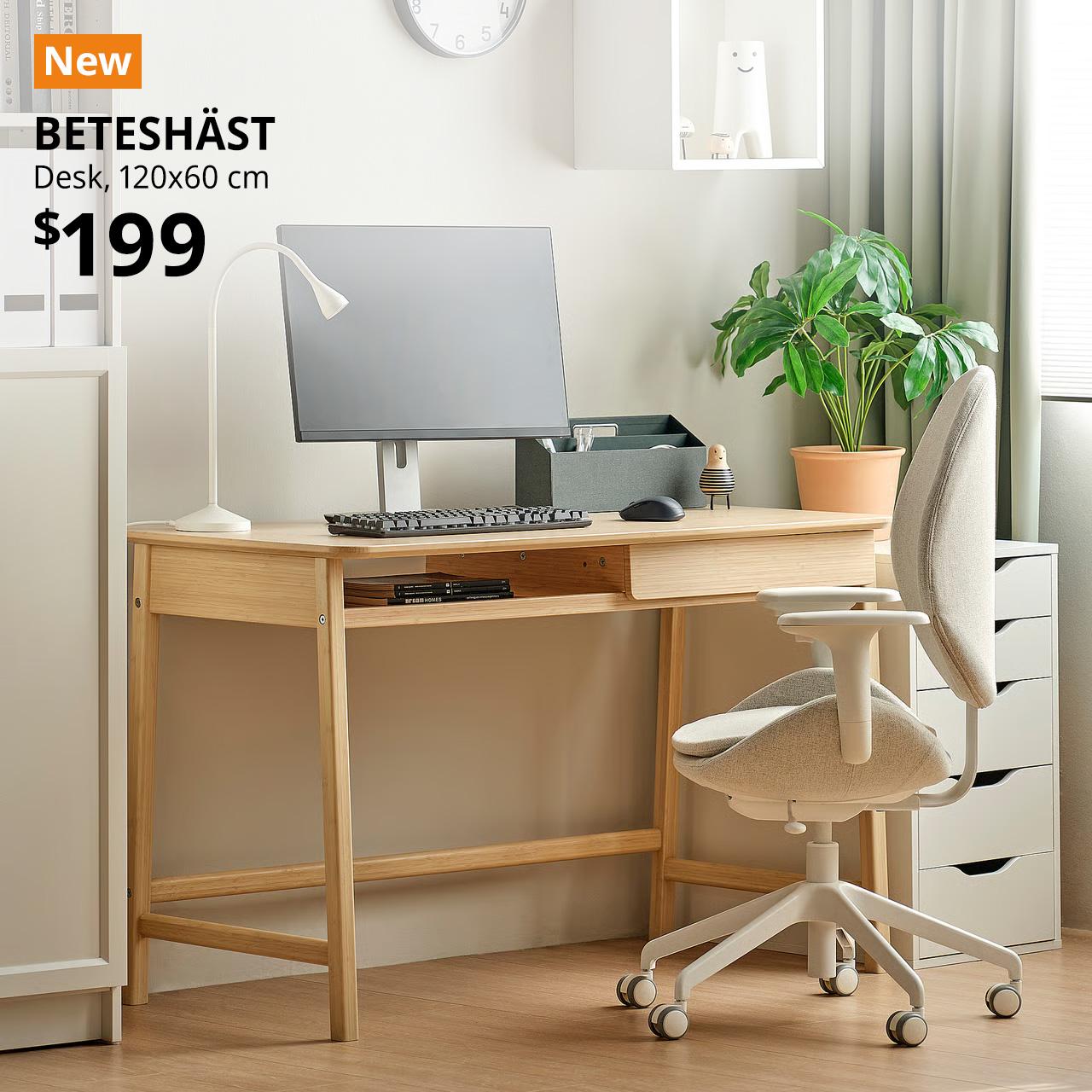 A light bamboo BETESHÄST desk with a simple work setup on it. On the top left corner, an orange tag with white text that reads 'New', followed by white text overlay image that reads 'BETESHÄST, 120x60 cm, $199'.
