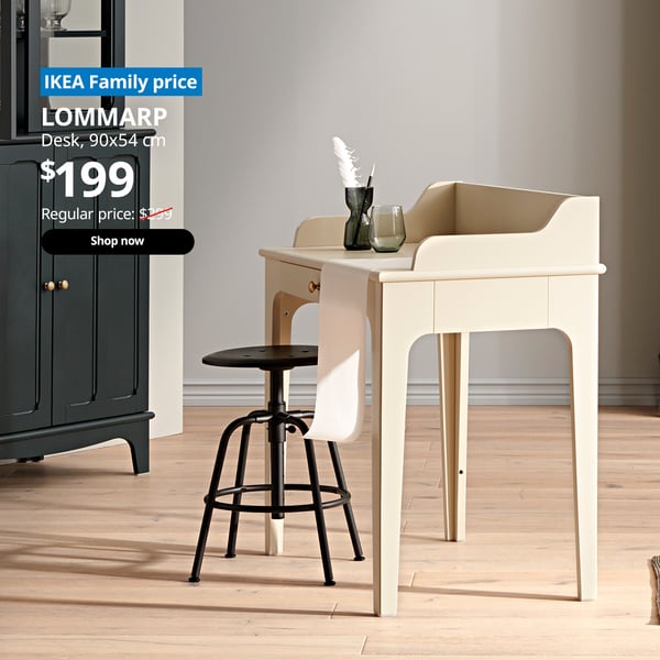 A light beige LOMMARP desk in a study room setting. On the top left corner, a blue tag with white text that reads 