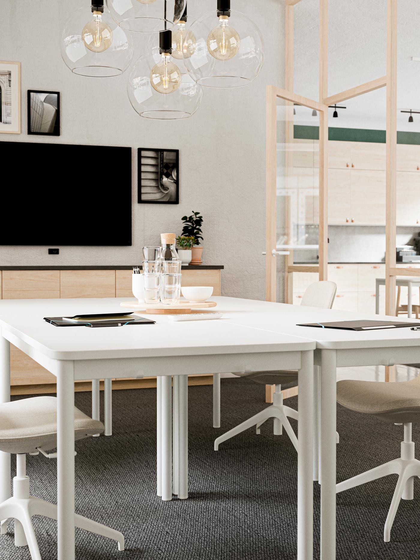 A light conference-room interior with beige-and-white LÅNGFJÄLL conference chairs around white TOMMARYD tables.