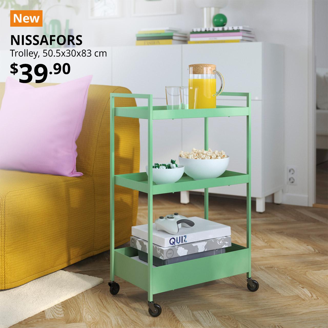 A light green NISSAFORS trolley with snacks and orange juice in a IKEA 365+ jug with lid is placed in the living room setting. Top seller tag followed by black text over image on the left that reads "NISSAFORS
Trolley, 50.5x30x83 cm." Price at $39.90.