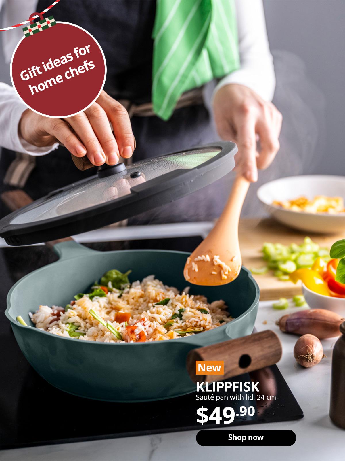 A light orange/dark red KNORRHANE spoon for cooking