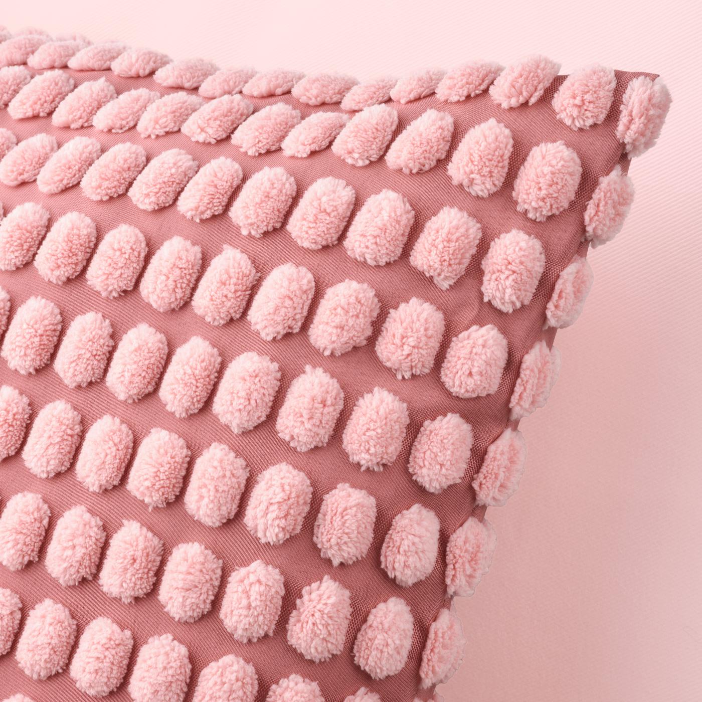 A light pink SVARTPOPPEL cushion cover