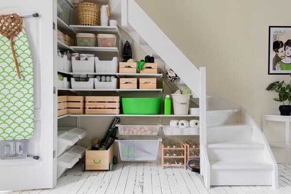 A living room with a cupboard under the stairs. Do you also want a neat pantry? Read our tips and get started with IKEA.