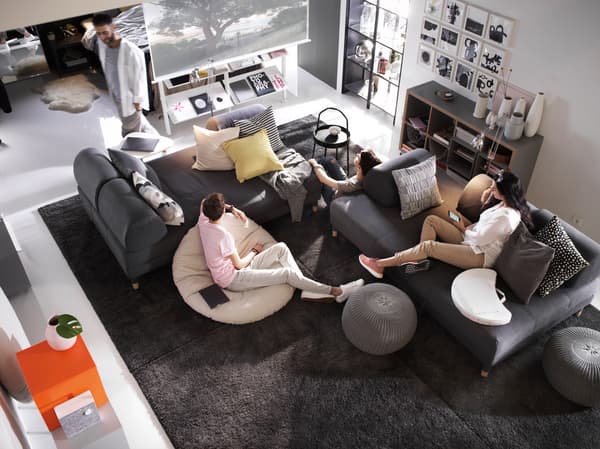   A living room with a group of friends having a good time.