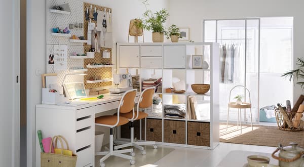 A living room with a KALLAX open shelve used as a room divider.