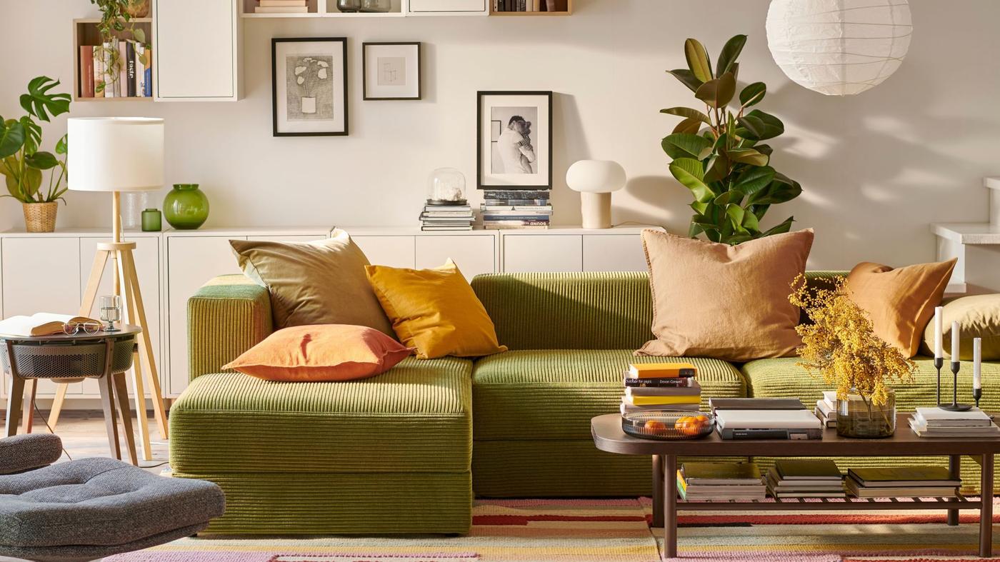 A living room with green couch.