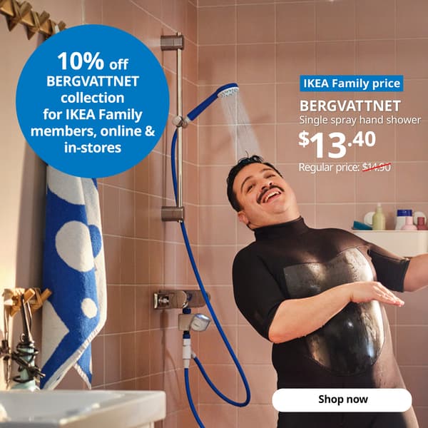 A man dancing in the shower while the water is running from the BERGVATTNET single spray hand shower with hose. White text of blue tag that reads 