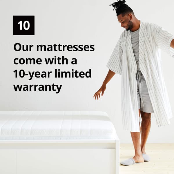 A man in a robe standing next to a mattress and a number 10 graphic symbol and the text 'Our mattresses come with a 10-year limited warranty' on the image.