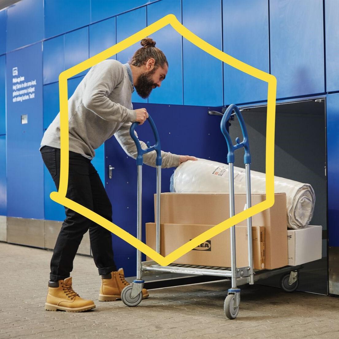 A man is picking up his IKEA Click & Collect order from an IKEA collect box, a locker that allows customers to collect their order without waiting in line
