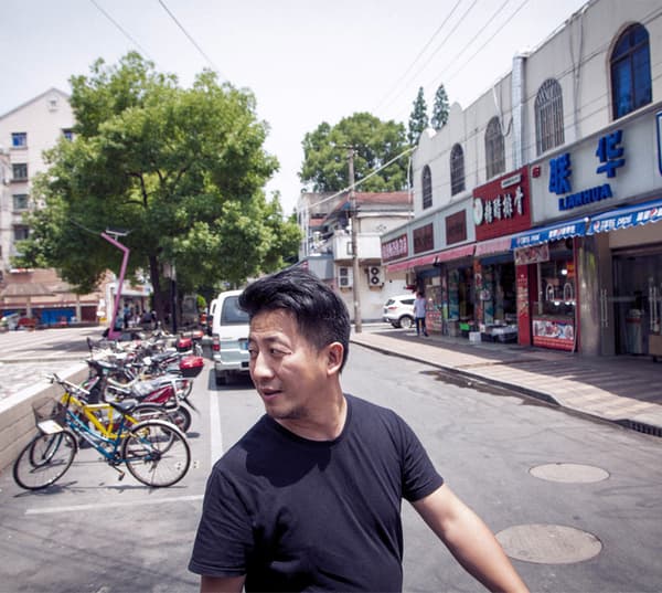 A man is taking a walk in the city.