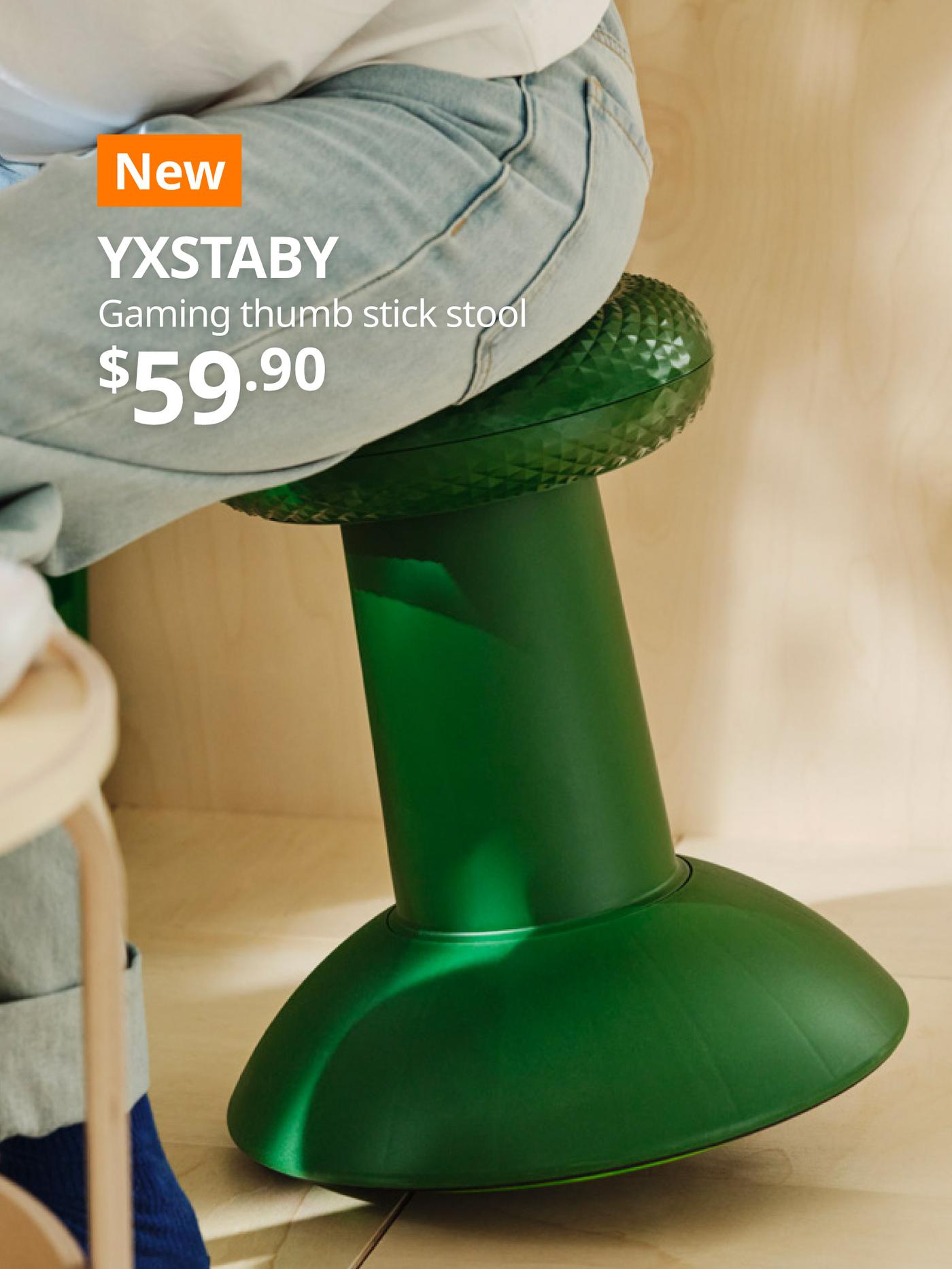 A man sitting on a green YXSTABY gaming thumb stick stool while playing XBOX game in a living room setting. On the top left, a orange tag with white text that reads 'New', followed by white text overlay image that reads 'YXSTABY, Gaming thumb stick stool, $59.90'.
