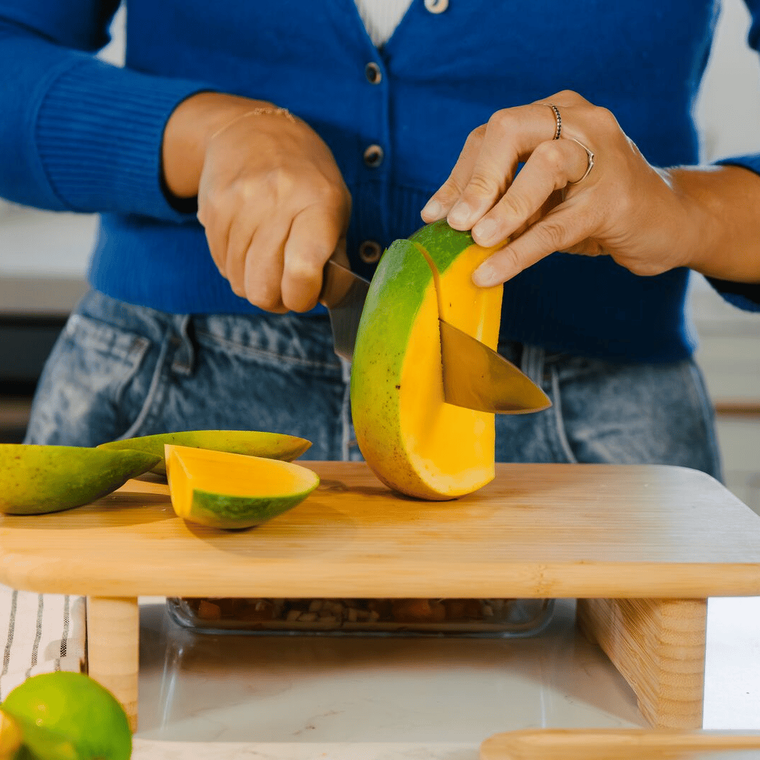 A mango being chopped