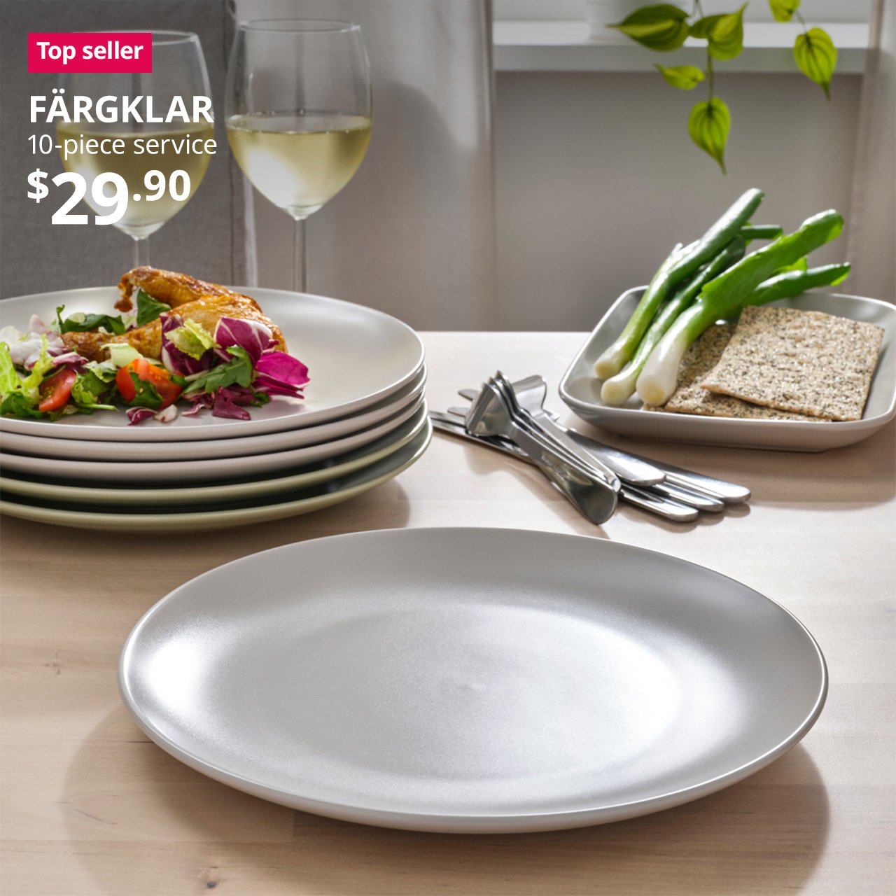 A matt light grey FÄRGKLAR 10-piece service set on a dinning room setting. A red "Top seller" label is on the top left of image, with black text below that reads: FÄRGKLAR, 10-piece service. Price $29.90.