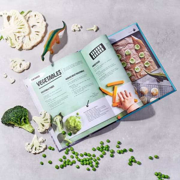 A MATVRÅ book Hey Flavours! open at a spread showing recipes on how to make baby food like vegetable purées.